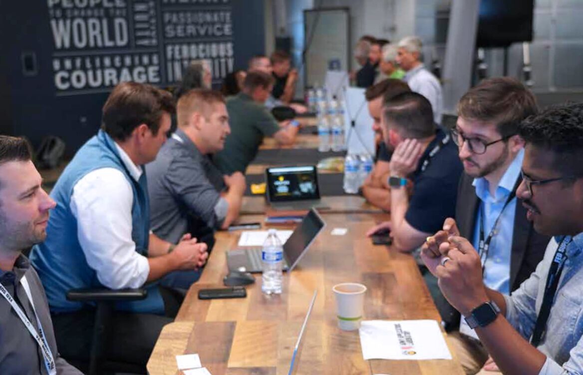 Group of people sitting at a meeting table