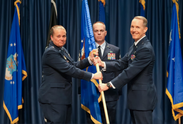 U.S. Air Force Lt. Gen. Linda Hurry, commander of Air Force Materiel Command, passes the guidon to U.S. Air Force Brig. Gen. Douglas Wickert during the Air Force Research Laboratory change of command ceremony at the National Museum of the U.S. Air Force, Wright-Patterson Air Force Base, Ohio, June 3, 2026.
